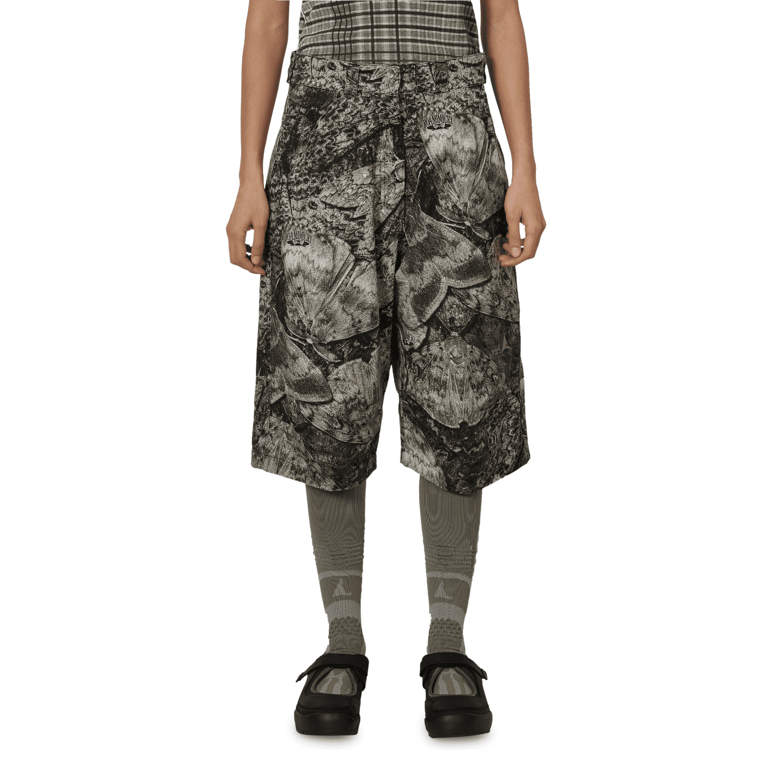 ROA Hiking - Siera Moth Print 3/4 Pant grayscale patterned culotte-style shorts, gray patterned tights, and black platform sandals.