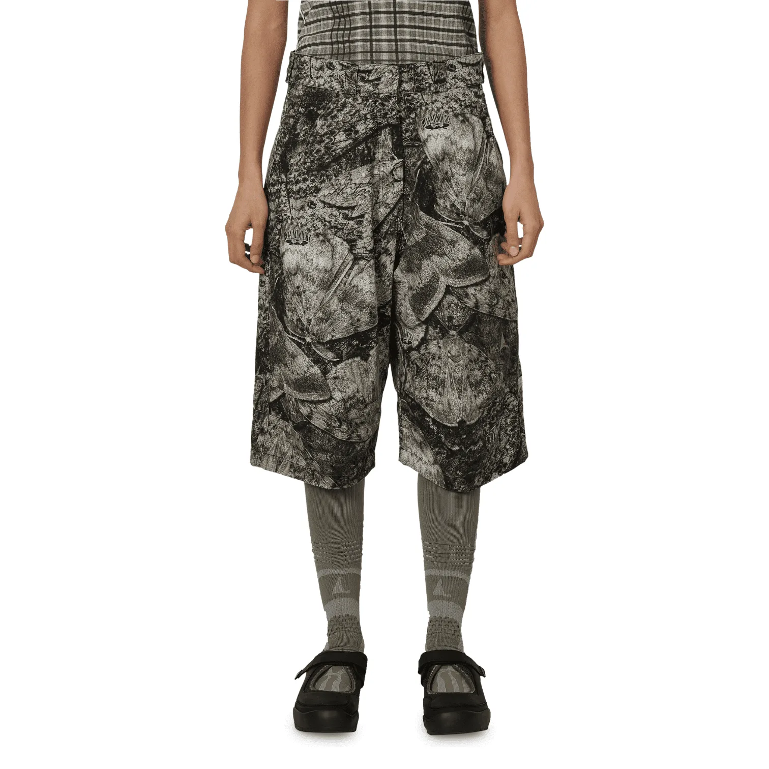 ROA Hiking - Siera Moth Print 3/4 Pant grayscale patterned culotte-style shorts, gray patterned tights, and black platform sandals.